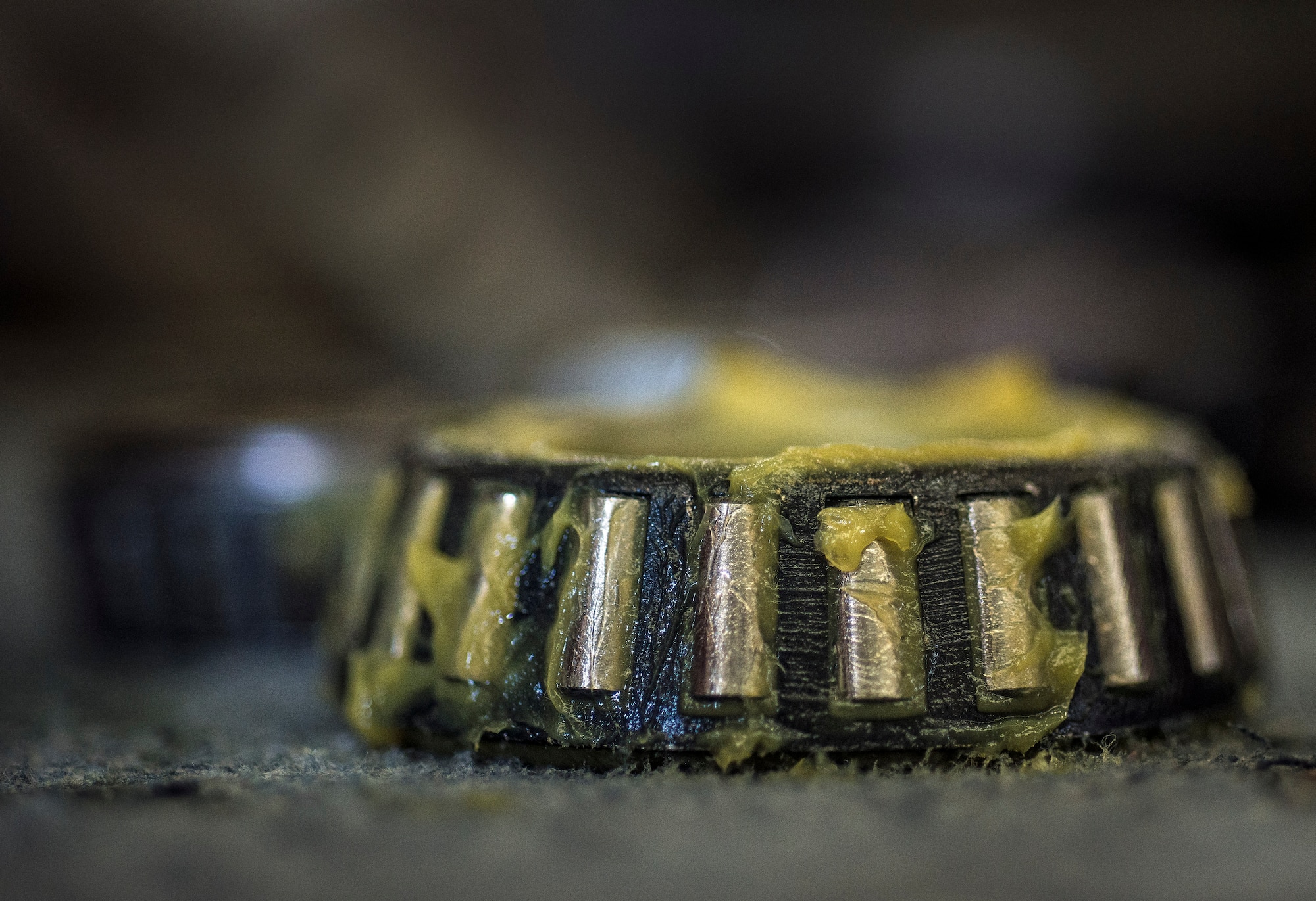 A wheel bearing is covered in new grease before being reinstalled Aug. 6, 2013, at Joint Base Charleston – Air Base, S.C. (U.S. Air Force photo/ Senior Airman Dennis Sloan)