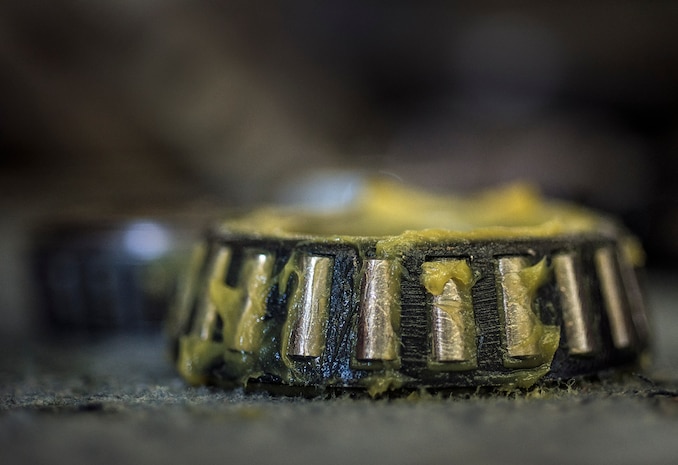 A wheel bearing is covered in new grease before being reinstalled Aug. 6, 2013, at Joint Base Charleston – Air Base, S.C. (U.S. Air Force photo/ Senior Airman Dennis Sloan)