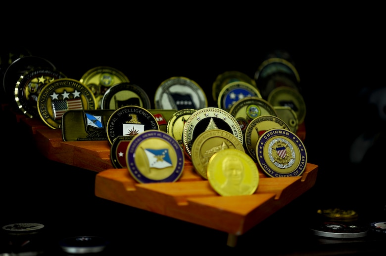 A small portion of coins displayed at the office of Master Sgt. Charles Mann, first sergeant for the 1st Special Operation Comptroller Squadron, on Hurlburt Field, Fl., Aug. 12, 2013. Mann’s vast coin collection consists of coins from squadron commanders to the head of the CIA. (U.S. Air Force photo/ Airman 1st Class Jeffrey Parkinson)