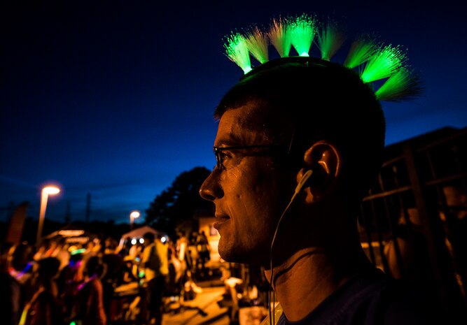 Petty Officer 3rd Class Matt Ramsey, Nuclear Power Training Unit student, wears a glow in the dark ‘Mohawk’ for the Nuclear Glow 5K Aug. 9, 2013, at Joint Base Charleston – Weapons Station, S.C. Service members and their families ran through base housing wearing glow-in-the-dark clothing and accessories. (U.S. Air Force photo/ Senior Airman Dennis Sloan)