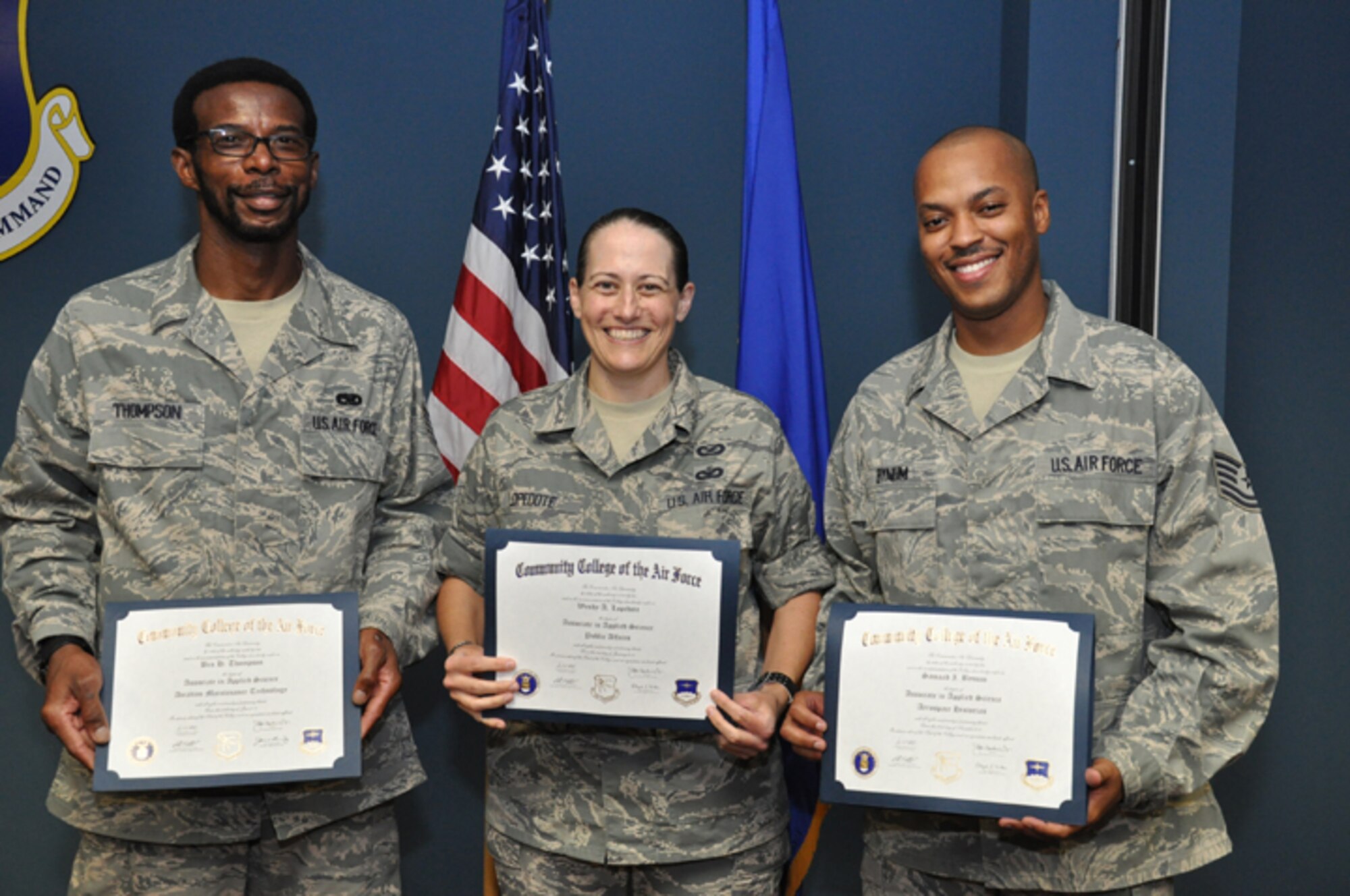 From left to right: Tech. Sgt. Ben Thompson, Master Sgt. Wendy Lopedote and Tech. Sgt. Samaad Bynum were awarded their Community College of the Air Force degrees during a ceremony held on the August drill weekend. (USAF photo by SSgt. Mark Thompson, 916ARW/PA)