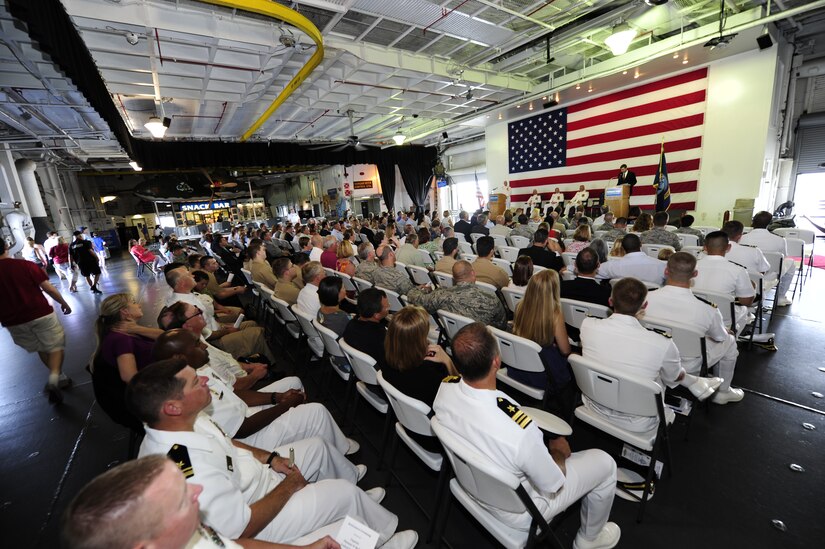 Members of Joint Base Charleston and the local community gather Aug. 9, 2013, aboard the USS Yorktown (CV 10), at Patriots Point Naval and Maritime Museum, Mount Pleasant, S.C., to honor Navy Capt. Thomas Bailey, JB Charleston deputy commander and former Naval Weapons Station commanding officer, as he retires after more than 30 years of naval service. (U.S. Air Force photo/Tech. Sgt. Rasheen Douglas)