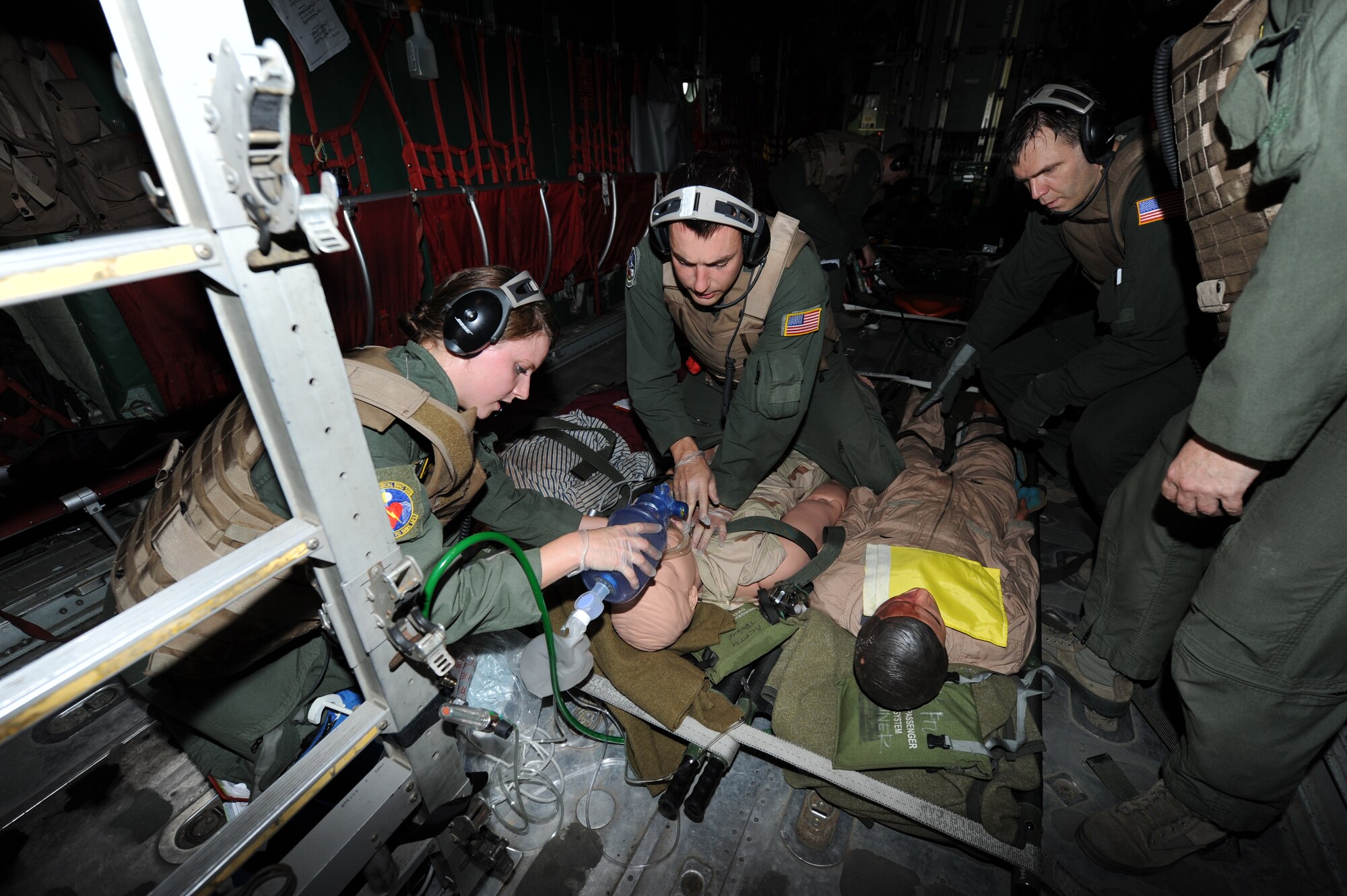 Senior Airman Sarah Snyder and Senior Airman Elijah Burns, students of the Aeromedical Evacuation Formal Training Unit, perform cardiopulmonary resuscitation on a patient that suffered cardiac arrest during a simulation exercise here Aug. 5. The students learn how to load medical equipment on aircraft and also learn how to use the equipment in order to care for patients while transporting them. (U.S. Air Force photo by Senior Airman Melissa Dearstone)