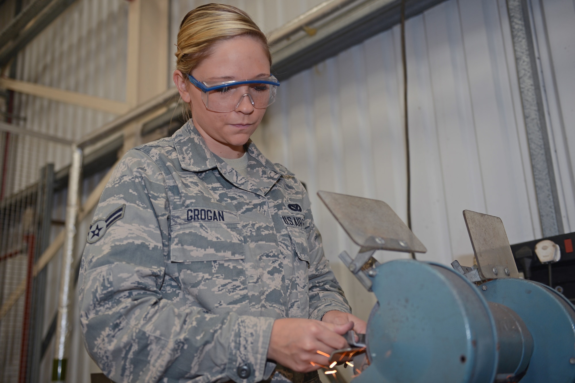 Airman 1st Class Kelli Grogan, 48th Civil Engineer Squadron structural apprentice, uses a metal grinder at Royal Air Force Lakenheath, England Aug. 13, 2013. Grogan was nominated for a Liberty Spotlight because she displays the core value of “Excellence in All We Do.” (U.S. Air Force photo by Airman 1st Class Trevor T. McBride/Released) 