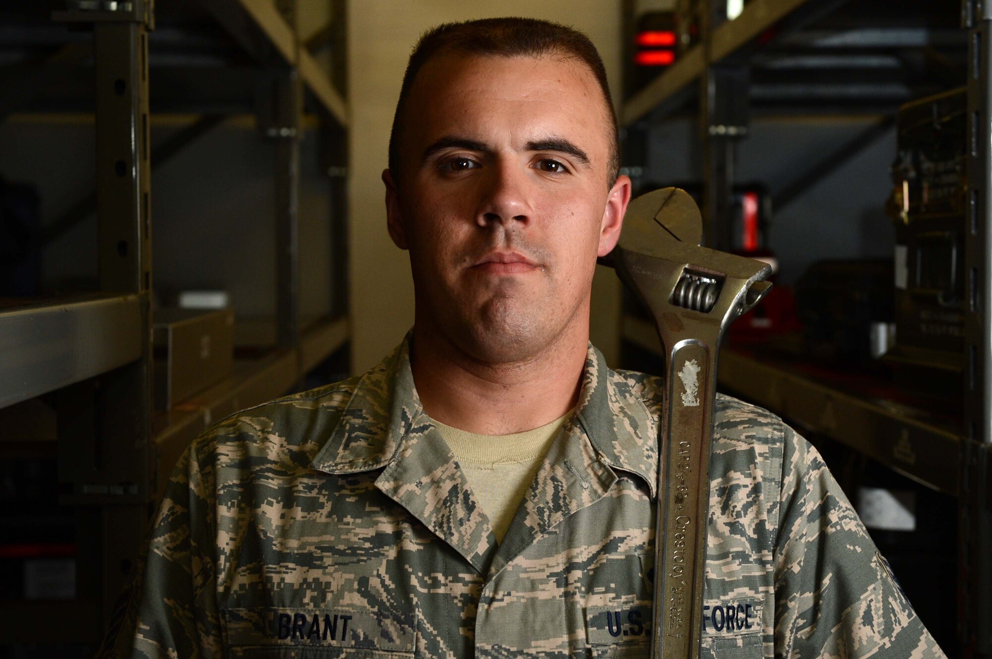 SPANGDAHLEM AIR BASE, Germany – U.S. Air Force Staff Sgt. Jeffrey Brant, 726th Air Mobility Squadron composite tool kit custodian from Millerton Pa., holds a wrench Aug. 13, 2013. Brant maintains accountability of equipment, and cleans and fixes tools in the tool room. (U.S. Air Force photo by Airman 1st Class Kyle Gese/Released)