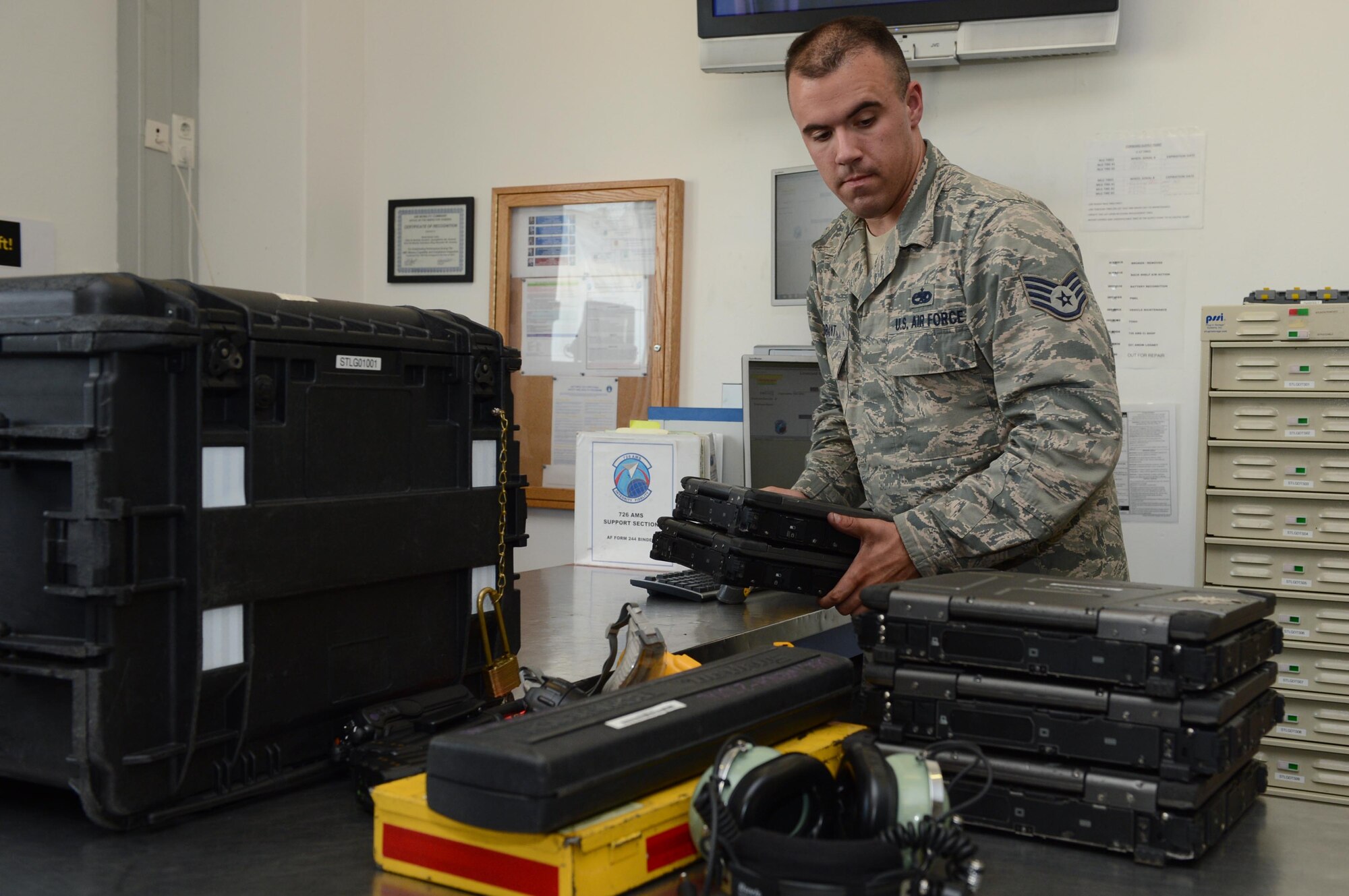 SPANGDAHLEM AIR BASE, Germany – U.S. Air Force Staff Sgt. Jeffrey Brant, 726th Air Mobility Squadron composite tool kit custodian from Millerton Pa., collects equipment that was checked out to maintainers Aug. 13, 2013. Aircraft maintenance units are responsible for servicing, inspecting, maintaining, launching and recovering aircraft. (U.S. Air Force photo by Airman 1st Class Kyle Gese/Released)
