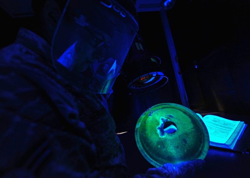 Senior Airman Whitnie Hendricks, 51st Maintenance Squadron nondestructive inspection journeyman, inspects a part from an A-10 Thunderbolt at the NDI lab at Osan Air Base, Republic of Korea, Aug. 13, 2013. NDI technicians like Hendricks are charged with inspecting aircraft and weapons systems components for structural damage, flaws, cracks, voids, heat damage and stress fractures. (U.S. Air Force photo/Senior Airman Siuta B. Ika)