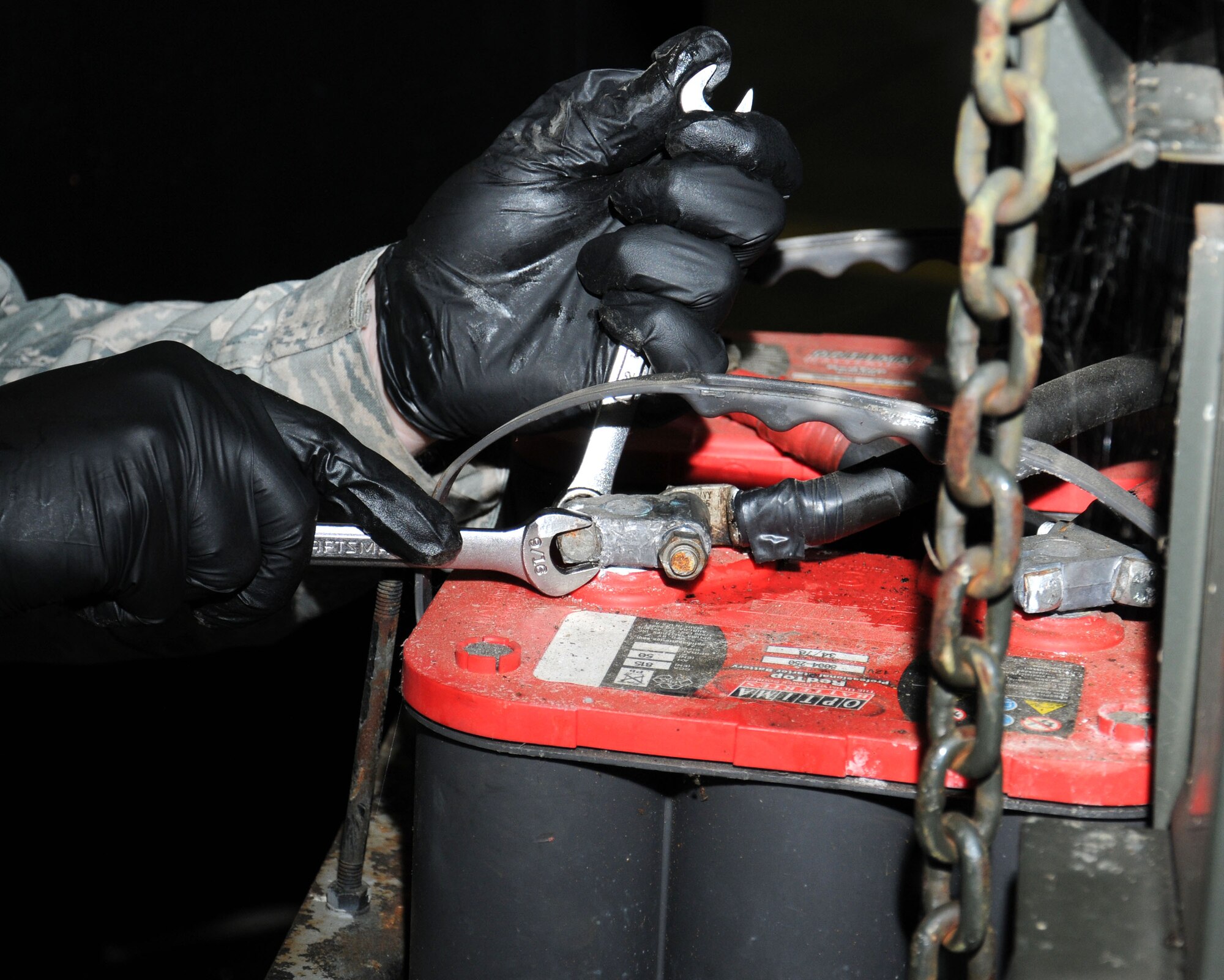 U.S. Air Force Staff Sgt. Jacob Anderson, 100th Civil Engineer Squadron Electrical Power Production craftsman from Greenfield, Mo., disconnects the negative terminal on a generator Aug. 13, 2013, on RAF Mildenhall, England. Anderson disconnected the terminal prior to maintenance work on the generator to reduce risk of injury. The generators are assigned to mission essential units and can be made available to other units when required. (U.S. Air Force photo by Gina Randall/Released)