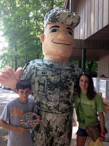 "Nat Guard" visits with some new friends during the Kentucky National Guard/4-H Youth Camp in Nancy, Ky., July 17, 2013. The National Guard’s values of Loyalty, Duty, Respect, Selfless Service, Honor, Integrity, and Personal Courage provide the framework used in combatting bullying in American schools.