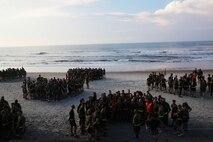 Marines with 2nd Maintenance Battalion, Combat Logistics Regiment 25, 2nd Marine Logistics Group broke into individual companies after a physical training session aboard Camp Lejeune, N.C., Aug. 14, 2013. The battalion went on a three mile beach run and then competed in a tug-of-war competition. (U.S. Marine Corps photo by Lance Cpl. Shawn Valosin)