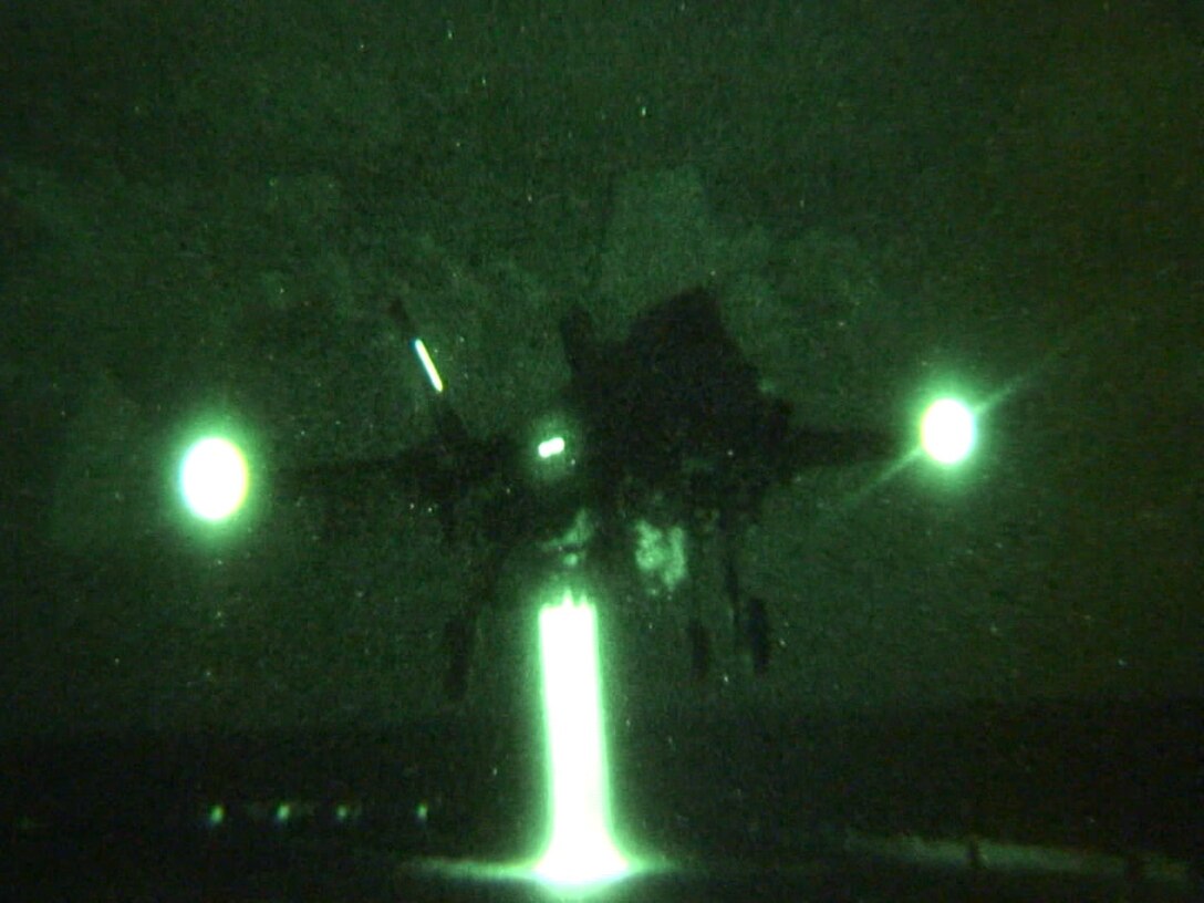 Lt. Col. C.R. “Jimi” Clift makes the first F-35B Lightning II night landing on USS Wasp  during the second at-sea F-35 developmental test event, Aug. 14. The F-35 Integrated Test Force  is embarked on the Wasp for three weeks to expand the F-35B operational envelope in preparation for Marine Corps initial operational capability test in 2015. (Photo by MCSN Michael T. Forbes II, U.S. Navy)