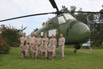 Marines of Marine Aviation Logistics Squadron 29 who repainted a UH-34 Seahorse in the aviation memorial aboard Marine Corps Air Station New River celebrated the completion of the project, Aug. 6. The repainting was needed to keep the helicopter in good condition so present and future generations can appreciate the aircraft of a past era.