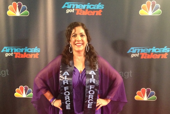 Dawn McClure poses during the American Military Spouses Choir's appearance on NBC's hit TV show, "America's Got Talent." McClure is one of 36 military spouses who performed recently at Radio City Music Hall, New York, during the show's quarterfinals and found out Aug. 7 that they'd made the show's semifinals. McClure's husband is Col. Gregory McClure, the Air Force Civil Engineer Center housing director. (Courtesy photo)