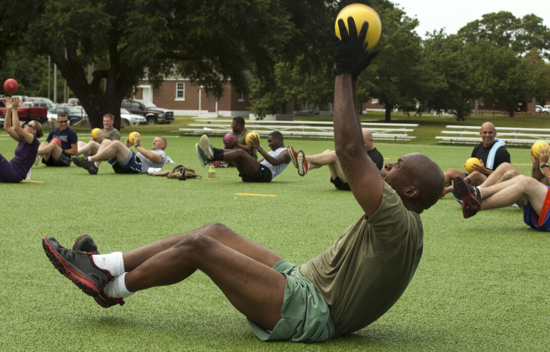 A participant of Hard Corps Beast, a High Intensity Tactical Training Center class, builds his core with a medicine ball during a tough group class at the H.I.T.T. Center aboard Camp Lejeune, Aug. 6. 
Find us on Google + (http://gplus.to/camp.lejeune)
Follow us on Twitter (http://twitter.com/camp_lejeune)
Like us on Facebook (http://www.facebook.com/camp.lejeune)
