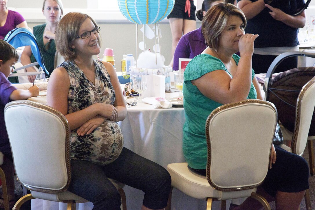 Expectant moms receive comforting words of support from LeAnn Morrissey, chief shower officer of Operation Shower, during a baby shower at the Ball Center aboard Marine Corps Base Camp Lejeune, Aug. 6. 
Find us on Google + (http://gplus.to/camp.lejeune)
Follow us on Twitter (http://twitter.com/camp_lejeune)
Like us on Facebook (http://www.facebook.com/camp.lejeune) 