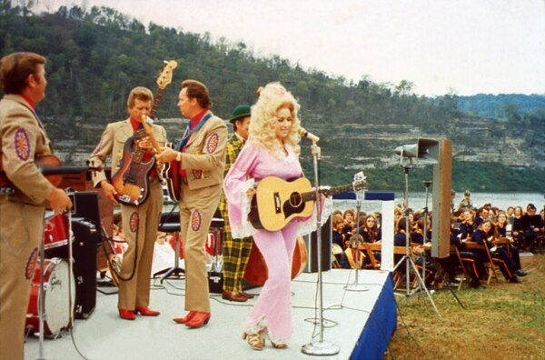 Country Music Star Dolly Parton performs at the Cordell Hull Dam Dedication Oct. 13, 1973 on the shore of the Cumberland River at the dam in Carthage, Tenn. According to an Associated Press report following the event about 2,000 people attended. Tricia Nixon Cox, daughter of President Richard M. Nixon, was the keynote speaker at the dedication.