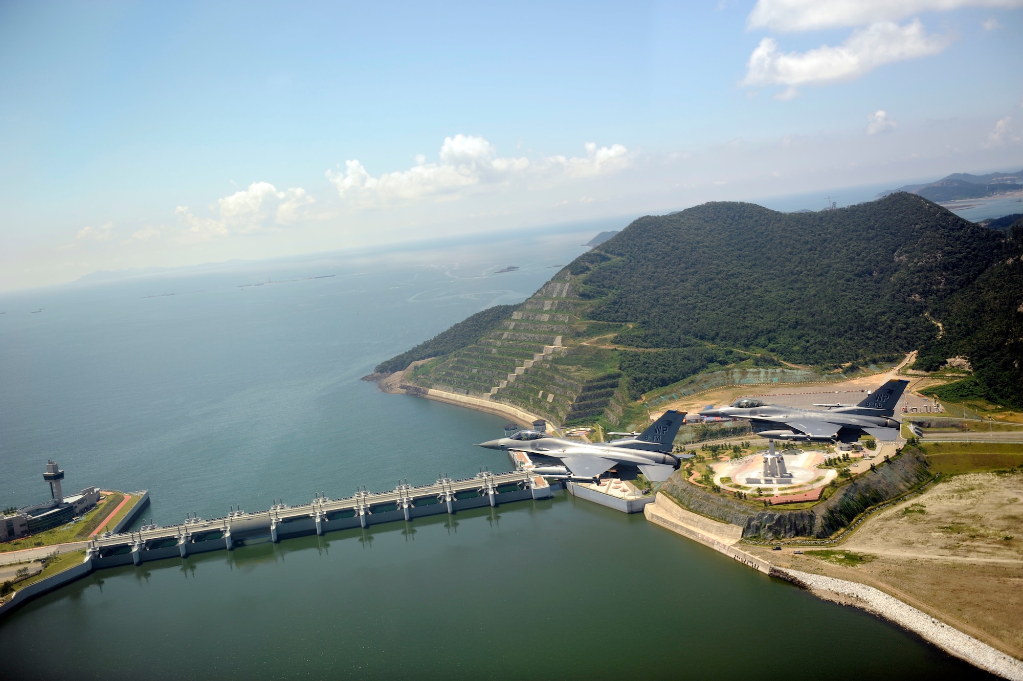 GUNSAN, Republic of Korea – Colonel S. Clinton Hinote, 8th Fighter Wing commander, and Lt. Col. Steve Tittel, 8th Operations Group deputy commander, pass the Saemangeum Sea Wall on their way back to Kunsan Air Base, Republic of Korea after a friendship flight, Aug. 14, 2013. Hinote and Tittel flew with leadership from the 38th Fighter Group, a Republic of Korea air force unit stationed at Kunsan Air Base. (U.S. Air Force photo by Senior Airman Clayton Lenhardt/Released)