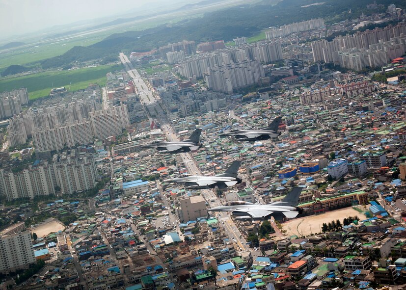 GUNSAN, Republic of Korea – Colonel S. Clinton Hinote, 8th Fighter Wing commander, leads a friendship flight with Republic of Korea air force Col. Min-Oh Seo, 38th Fighter Group commander, over Gunsan ROK, Aug. 14, 2013. The flight allowed ROK air force and U.S. Air Force pilots to practice aerial maneuvers and teamwork. (U.S. Air Force photo by Senior Airman Clayton Lenhardt/Released)
