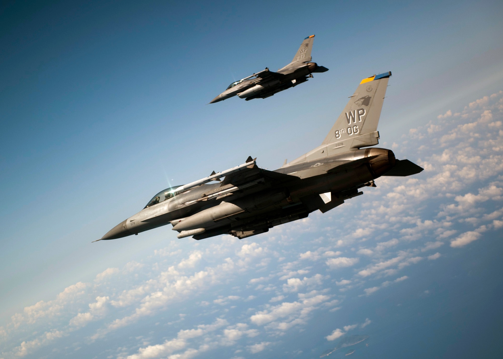 GUNSAN, Republic of Korea – Colonel S. Clinton Hinote, 8th Fighter Wing commander, rear, and Lt. Col. Steve Tittel, 8th Operations Group deputy commander, fly F-16s towards a rendezvous point during a friendship flight, Aug. 14, 2013. Hinote and Tittel flew with leadership from the 38th Fighter Group, a Republic of Korea air force unit stationed at Kunsan Air Base. (U.S. Air Force photo by Senior Airman Clayton Lenhardt/Released)