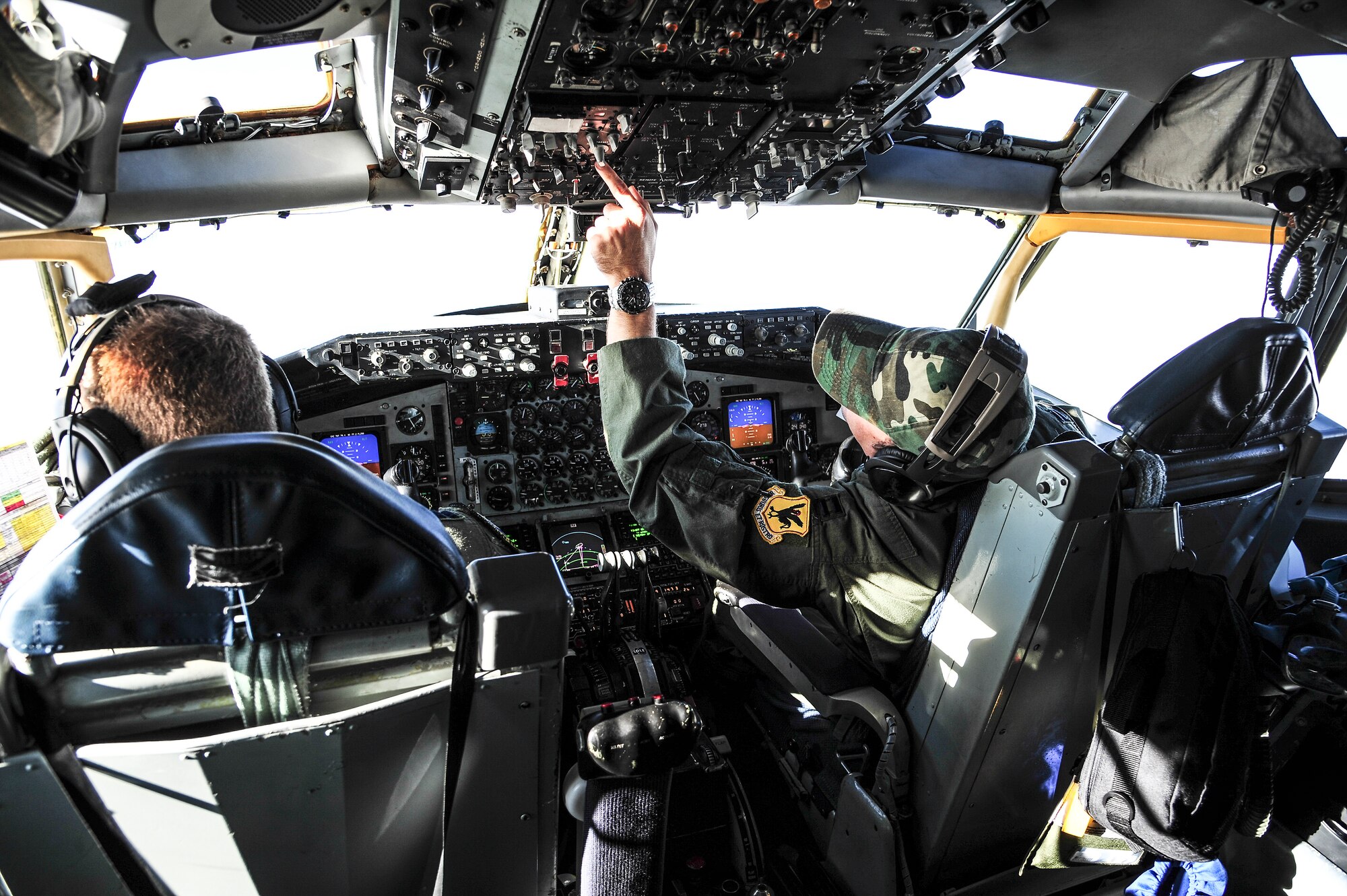 Capts. Tanner Betsinger and John Davis, 909th Air Refueling Squadron pilots from Kadena Air Base, Japan, pilot a KC-135 Stratotanker from over the Joint Pacific Alaska Range Complex during RED FLAG-Alaska 13-3 Aug. 14, 2013. More than 2,600 personnel from U.S. and allied forces are participating in the two-week long exercise. (U.S. Air Force photo by Senior Airman Zachary Perras/Released)