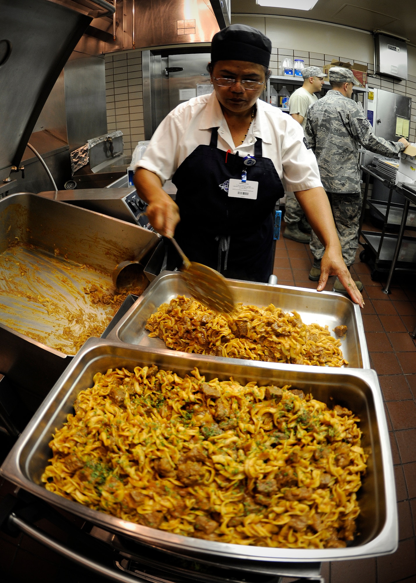 Cabiab Gadow, 354th Force Support Squadron contracted cook, prepares beef stroganoff prior to the lunch rush during RED FLAG-Alaska 13-3 at the Two Seasons Dining Facility Aug. 15, 2013, Eielson Air Force Base, Alaska. During RF-A 13-3 the DFAC here dishes out more than 2,400 meals per day, which is swollen from their normal rate of around 400. (U.S. Air Force photo by Senior Airman Shawn Nickel/Released)