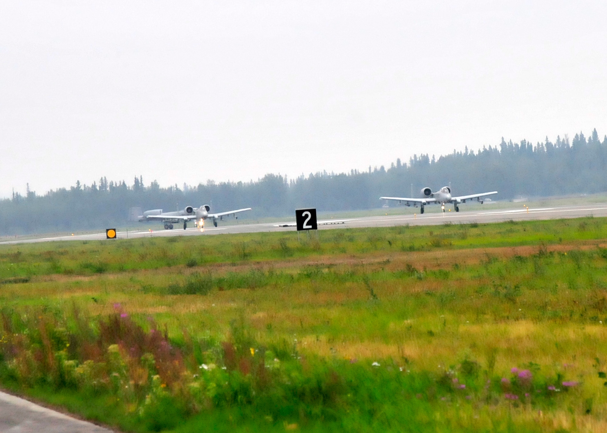 A-10 Thunderbolt aircraft, 122nd Fighter Wing, 163rd Fighter Squadron, Indiana Air National Guard, Ft. Wayne, Ind. taxi and take-off as part of RED FLAG-Alaska 13-3, Aug. 12, 2013, Eielson Air Force Base, Alaska. (U.S. Air Force photo by Staff Sgt. Kirsten Wicker/Released)