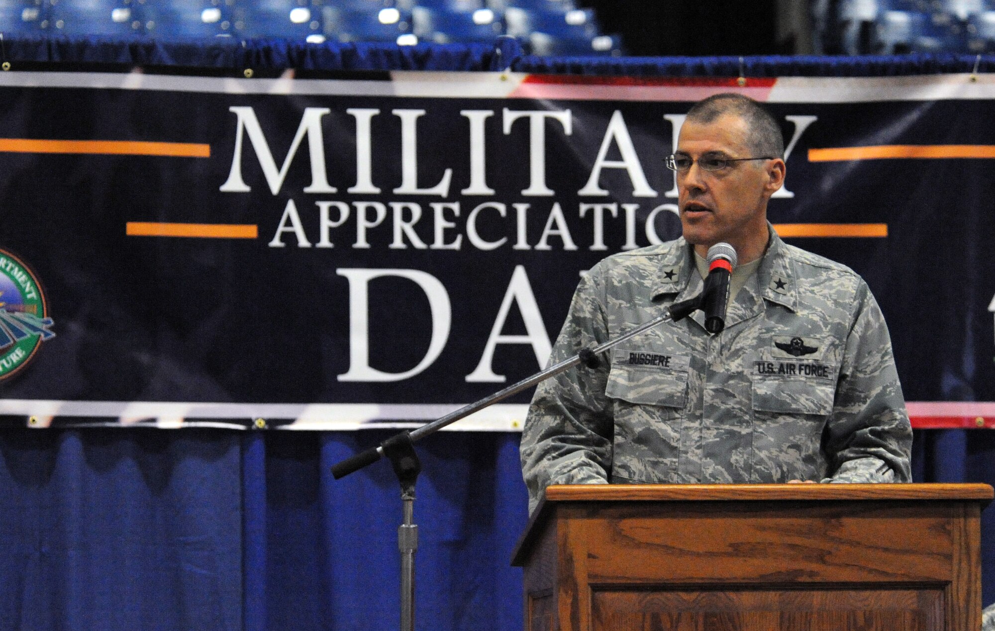 U.S. Air Force Brig. Gen. Thomas Bussiere, 509th Bomb Wing commander, talks to the crowd about Whiteman Air Force Base’s mission, Aug. 11, 2013, at the Missouri State Fair in Sedalia, Mo. He said the community’s support is vital to making sure Missouri’s Airmen and Soldiers can focus on getting the job done. (U.S. Air Force photo by Staff Sgt. Brigitte N. Brantley/Released)