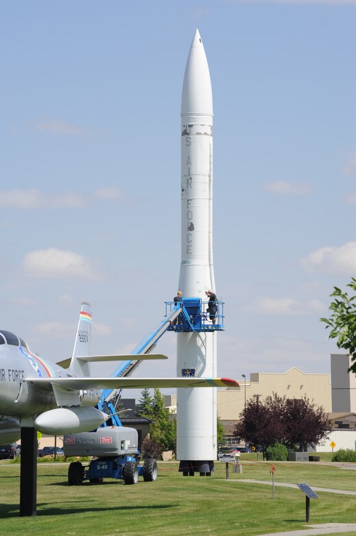 Workers repair damage on a Minuteman III missile static display at the Malmstrom Air Museum. Funds for the restoration process were set aside by Air Force Global Strike Command during fiscal year 2012. (U.S. Air Force photo/Airman 1st Class Collin Schmidt)

