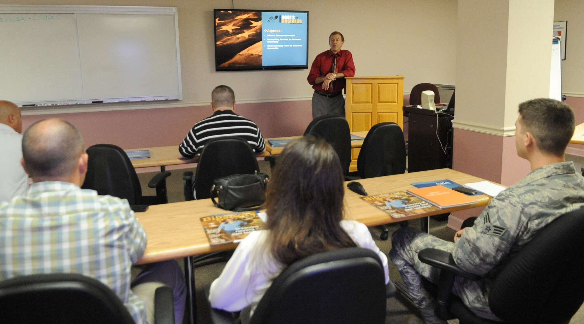 Rande Kessler, Louisiana Small Business Development Center director, introduces the Boots to Business workshop to Team Barksdale members at the Airman and Family Readiness Center on Barksdale Air Force Base, La., Aug. 14, 2013. The Boots to Business workshop provides those who are transitioning out of the military with information on business laws and financing, how to create a business plan, choose a business structure and how to register your business and obtain business licenses. (U.S. Air Force photo/Senior Airman Kristin High) 