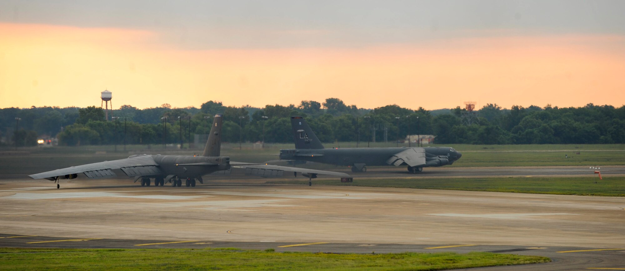 B-52H Stratofortress bombers taxi on the runway during a minimum interval takeoff on Barksdale Air Force Base, La., Aug. 15, 2013. This accelerated launch procedure allows aircraft to respond as rapidly as possible when called upon. In a conventional conflict, the B-52 can perform strategic attack, close-air support, air interdiction, offensive counter-air and maritime operations. (U.S. Air Force photo/Airman 1st Class Andrew Moua)