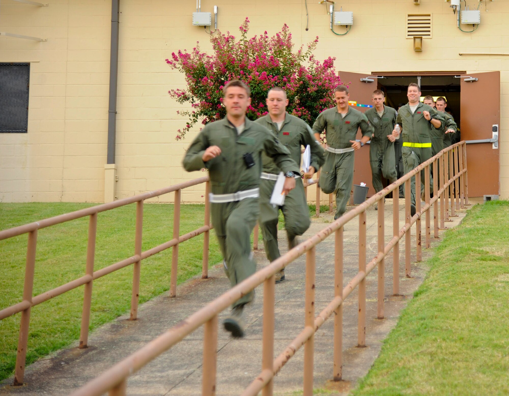 Aircrew members rush to their B-52H Stratofortress aircraft on a simulated alert on Barksdale Air Force Base, La., Aug. 15, 2013. Ten B-52 aircrews executed a minimum interval takeoff, a procedure which allows aircraft to quickly respond and deliver precision munitions to the battlefield. For the past 60 years the B-52 has provided long-range bombing capability and is capable of launching the widest array of weapons in the U.S. arsenal. (U.S. Air Force photo/Airman 1st Class Andrew Moua)