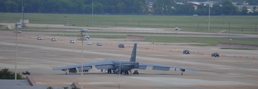 Alert crews respond to their aircraft during a minimum interval takeoff on Barksdale Air Force Base, Aug. 15, 2013. A MITO take-off uses starter cartridges filled with gun powder to quickly fire up the B-52H Stratofortress engines. The B-52 is capable of flying 7,652 nautical miles, or 8,800 miles, without being refueled by another aircraft. (U.S. Air Force photo/Senior Airman Sean Martin)