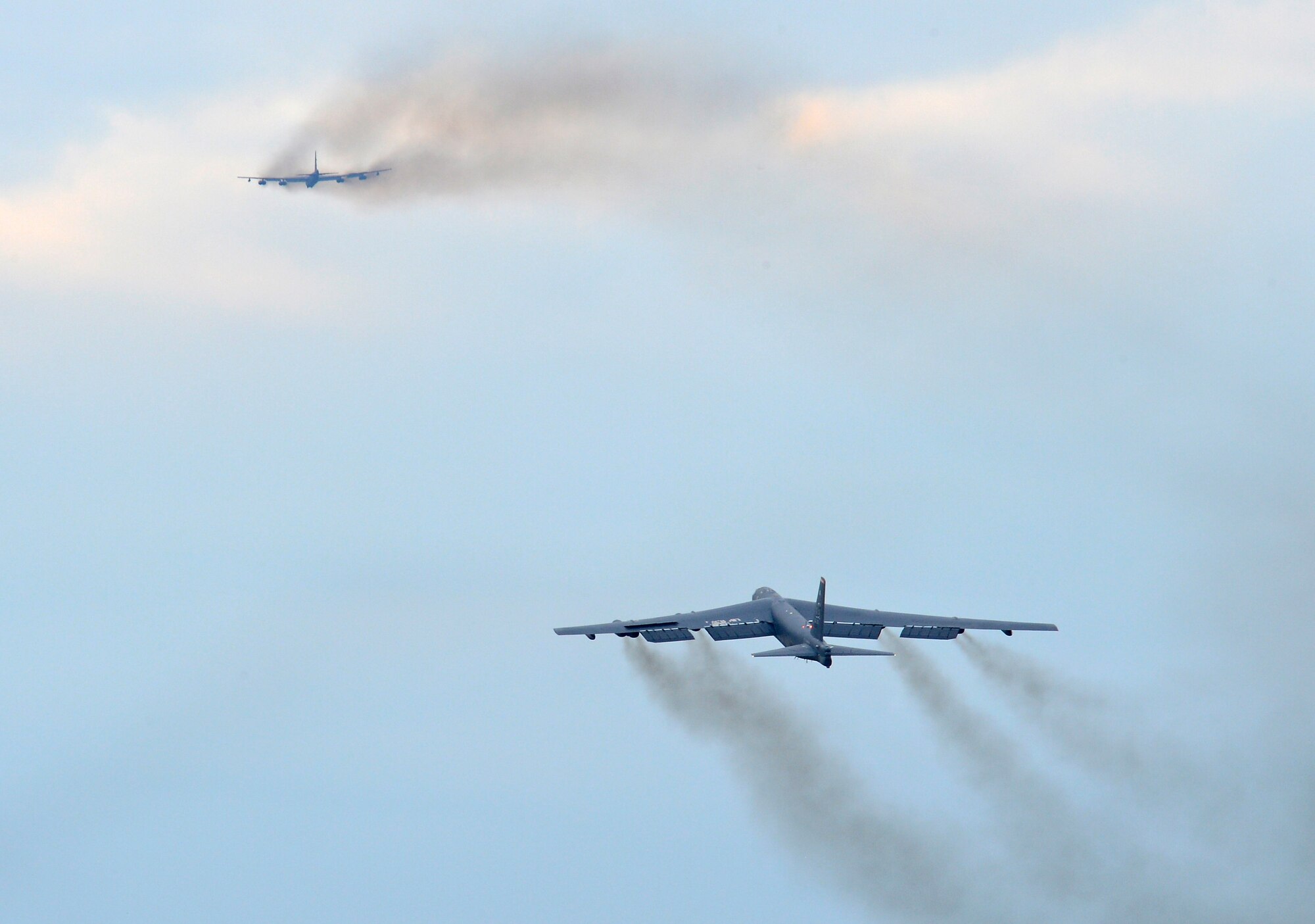 B-52H Stratofortress bombers execute a minimum interval takeoff from Barksdale Air Force Base, La., Aug. 15, 2013. The aircraft?s dark grey color helps the B-52 blend in when flying at higher altitudes, at night or over large bodies of water. (U.S. Air Force photo/Senior Airman Micaiah Anthony)