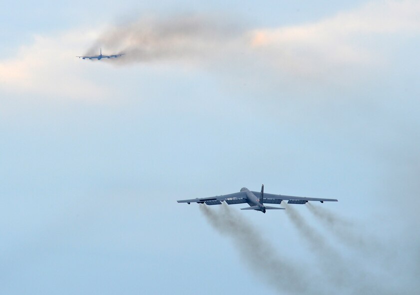 B-52H Stratofortress bombers execute a minimum interval takeoff from Barksdale Air Force Base, La., Aug. 15, 2013. The aircraft?s dark grey color helps the B-52 blend in when flying at higher altitudes, at night or over large bodies of water. (U.S. Air Force photo/Senior Airman Micaiah Anthony)