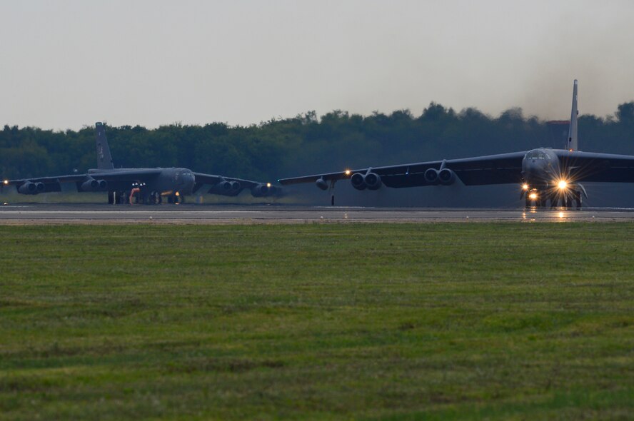 B-52H Stratofortress bombers prepare to execute a minimum interval takeoff on Barksdale Air Force Base, La., Aug. 15, 2013. The B-52 is capable of flying 7,652 nautical miles, or 8,800 miles, without being refueled by another aircraft. The long-range heavy bomber is capable of carrying 70,000 pounds of mixed ordnance. (U.S. Air Force photo/Senior Airman Micaiah Anthony)