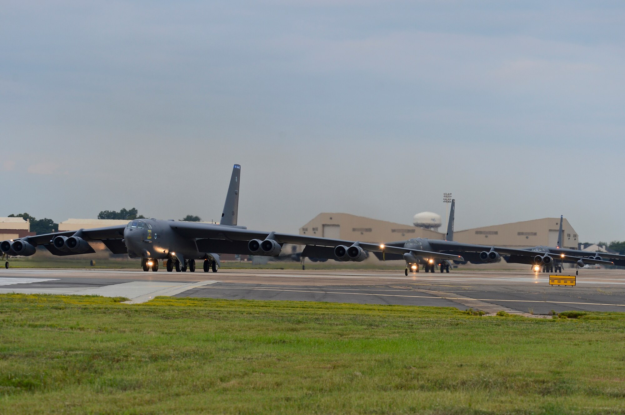 B-52H Stratofortress bombers prepare to takeoff on Barksdale Air Force Base, La., Aug. 15, 2013. Ten B-52 crews executed a minimum interval take-off. This accelerated launch procedure allows our deterrent force to respond as rapidly as possible when called upon. (U.S. Air Force photo/Senior Airman Micaiah Anthony)
