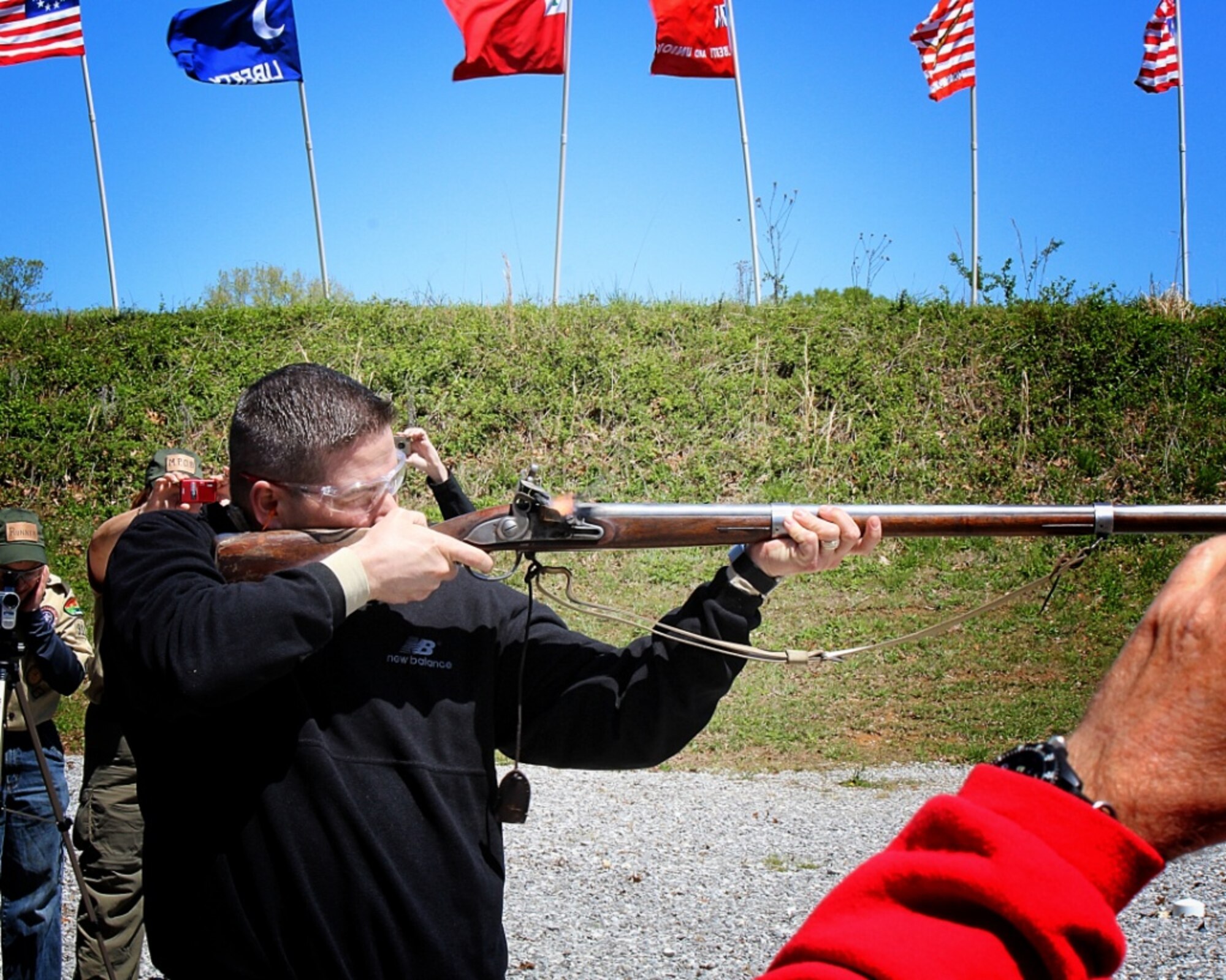 Arnold Engineering Development Complex (AEDC) Commander Col. Raymond Toth fires a 1770s replica musket at a recent Project Appleseed Rifle Clinic at the AEDC Rifle Range complex. (Photo provided by Claude Morse)