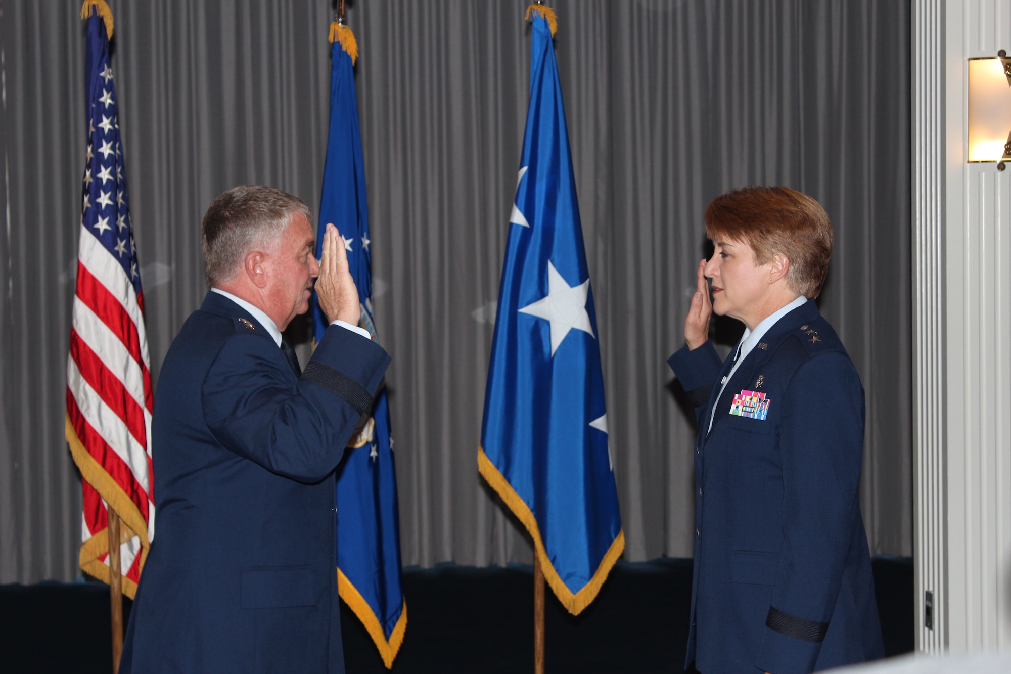 Air Force Surgeon General Lt. Gen. (Dr.) Thomas W. Travis officiates the promotion of Maj. Gen. Dorothy A. Hogg, Assistant Air Force Surgeon General, Medical Force Development and Chief of the Nurse Corps, during a ceremony on Aug. 12, 2013 at Bolling Air Force Base, Md. (Photo by Jon Stock, U.S. Air Force)
