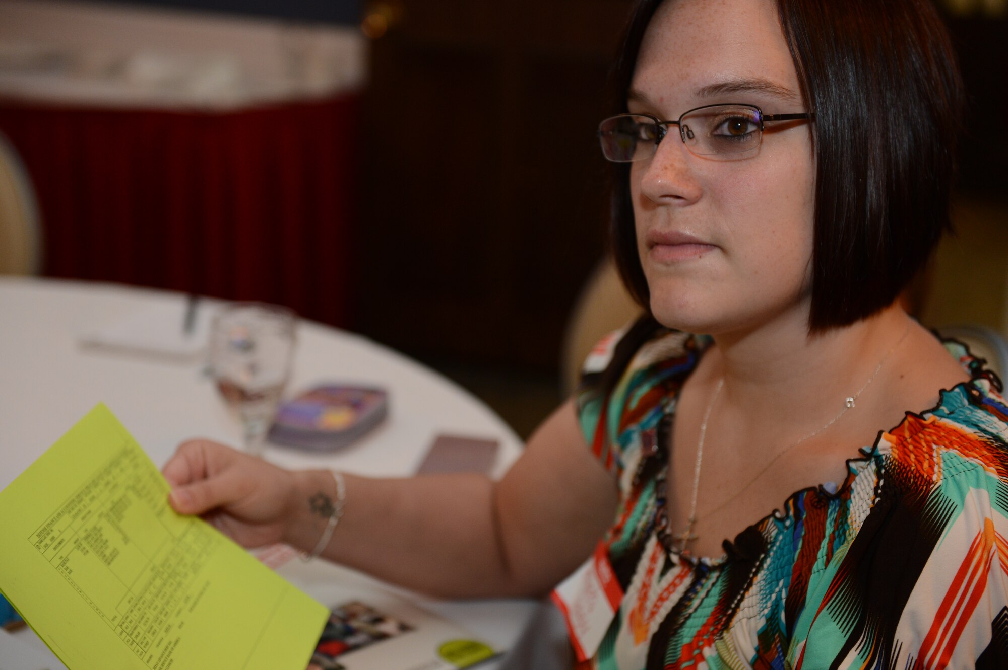 Amanda Langley, a military spouse, listens to a 20th Comptroller Squadron customer service technician explain how to read a leave and earnings statement during a event called Heart Link at the Carolina Skies Club and Conference Center at Shaw Air Force Base, S.C., Aug. 13, 2013. Heart Link is a quarterly orientation for spouses to introduce them to military life. The next event is scheduled for Nov. 5. (U.S. Air Force photo by Airman 1st Class Krystal M. Jeffers/Released)