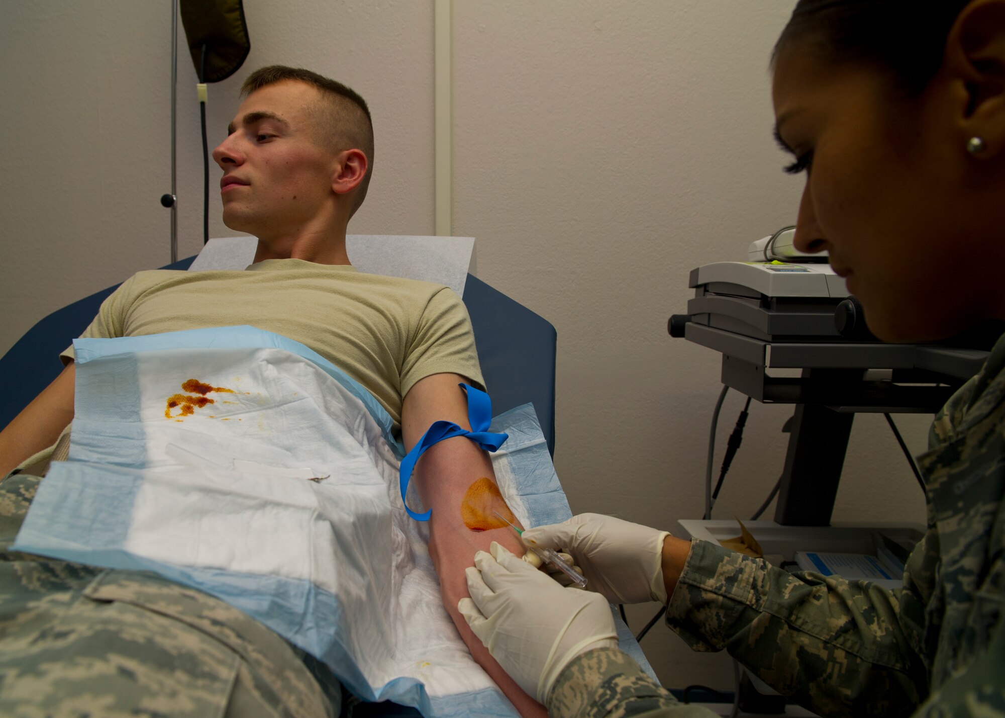 Staff Sgt. Veronica Sena, 49th Medical group aerospace medicine craftsman, prepares to insert an IV into a patient at Holloman Air Force Base, N.M. Aug. 14. The 49th MDG has 13 sections that work directly with patients and serves over 14,000 beneficiaries. The group employs 222 active-duty and civilian personnel with various jobs supporting the medical needs of Team Holloman. (U.S Air Force photo by Airman 1st Class Leah Murray/Released)
