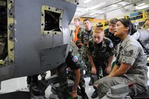 YOUNGSTOWN AIR RESERVE STATION, Ohio—Air Force Reserve Staff Sgt. Jenelle Rodriguez, an aerospace propulsion journeyman with the 910th Maintenance Squadron, explains the intake of the C-130 T56 Alison engine to Civil Air Patrol cadets here, July 31. The Civil Air Patrol toured facilities including the propulsion shop, Navy and Marine Corps Reserve Center and the 910th aerial spray facilities. U.S. Air Force photo by SrA Rachel Kocin.