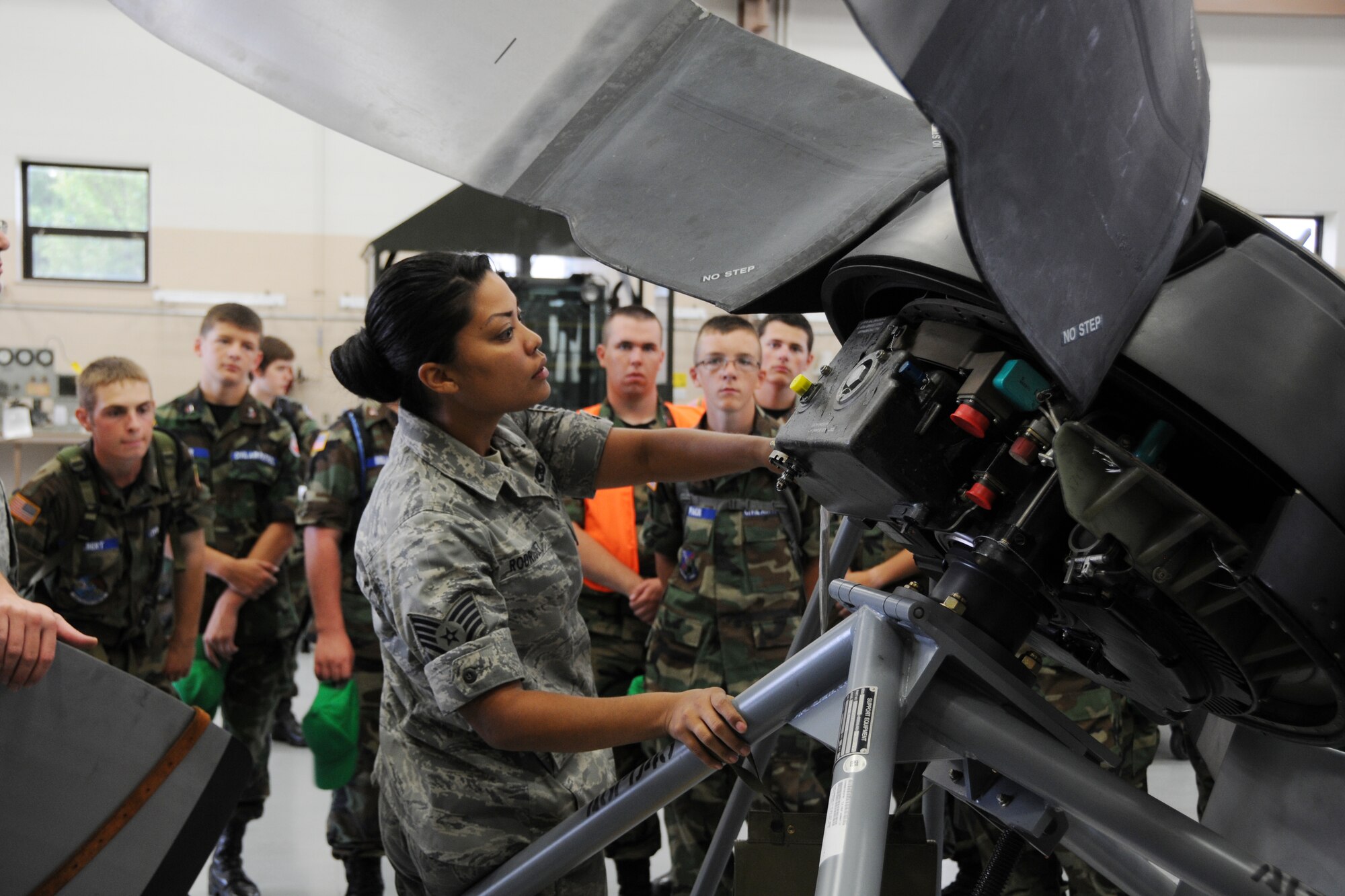 YOUNGSTOWN AIR RESERVE STATION, Ohio—Air Force Reserve Staff Sgt. Jenelle Rodriguez, an aerospace propulsion journeyman with the  910th Maintenance Squadron, explains the functioning of a C-130H Hercules propeller to Civil Air Patrol cadets here, July 31. The Civil Air Patrol toured facilities including the propulsion shop, Navy and Marine Corps Reserve Center and the 910th aerial spray shop. U.S. Air Force photo by SrA Rachel Kocin.