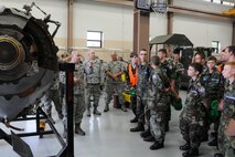 YOUNGSTOWN AIR RESERVE STATION, Ohio—Air Force Reserve Staff Sgt. Derek Pressell, an aerospace proplusion technician, with the  910th Maintenance Squadron explains the components of a C-130H Hercules aircraft cut away engine to Civil Air Patrol cadets. The Civil Air Patrol toured facilities including Propulsion shop, Navy and Marine Corps Reserve center and the 910th aerial spray facilities. U.S. Air Force photo by SrA Rachel Kocin.