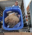 Gerardo Gutierrez, JBSA-Randolph Recycle Center technician, transfers paper prior to recycling Aug. 8. (U.S. Air Force photo by Don Lindsey/ Released)

