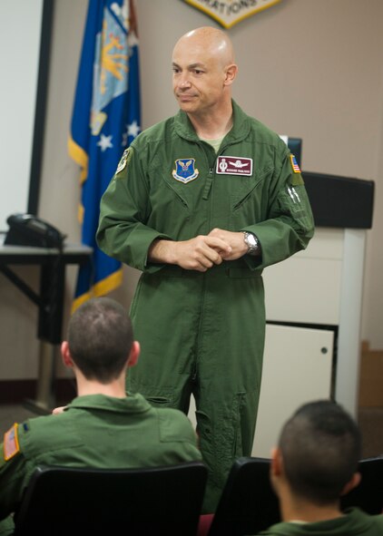 Col. Richard P. Pagliuco, commander of the 91st Operations Group, speaks at the group’s weekly mass briefing on July 24, 2013. Pagliuco assumed command of the 91st OG in June 2013. (U.S. Air Force photo by/Airman 1st Class Apryl Hall)
