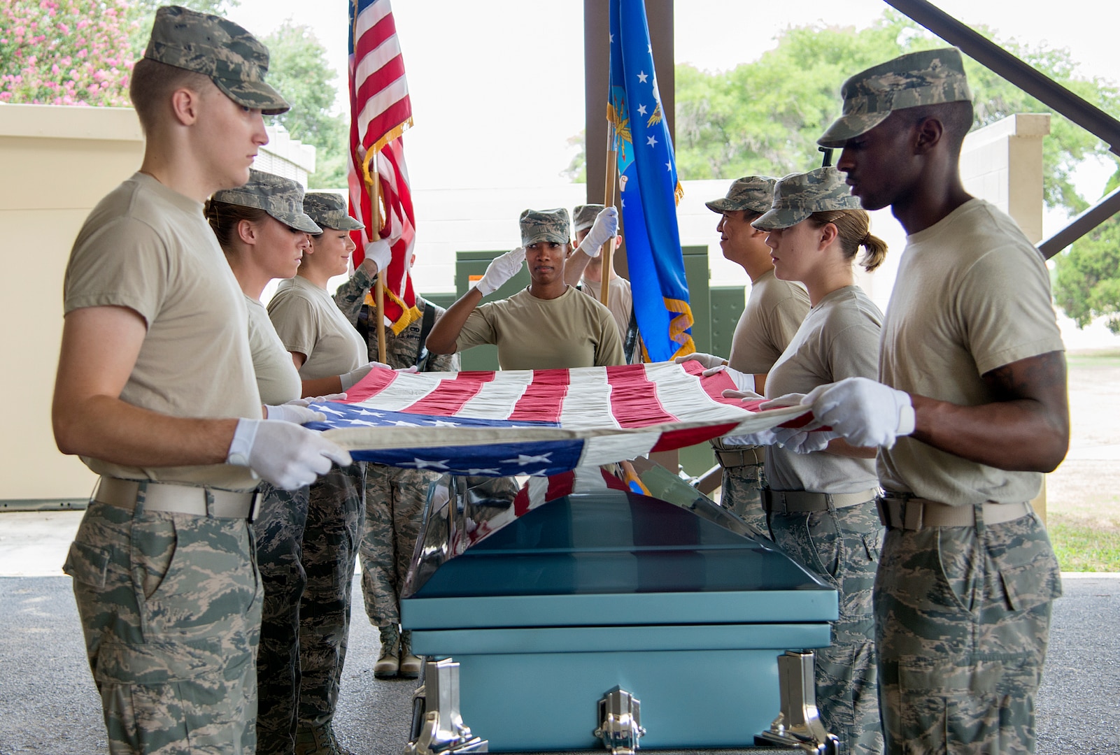 Joint Base San Antonio Honor Guard members perform proper burial procedures at the first
combined honor guard practice Aug. 8 at JBSA-Lackland. (U.S. Air Force photo by Benjamin Faske/ Released)