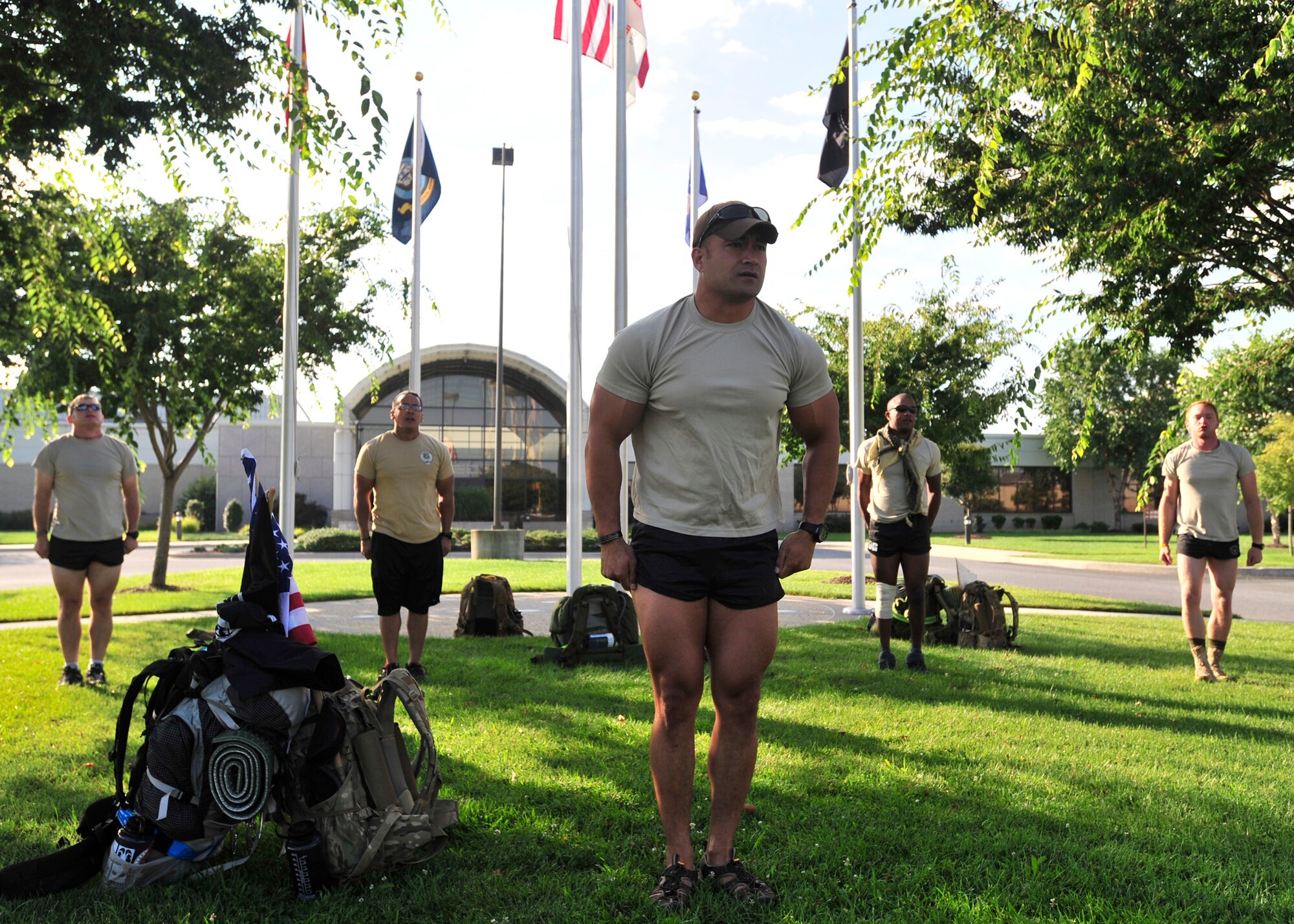 Members of the 13th Air Support Squadron “Delta Flight” assigned to Fort Carson, Colo., stand at attention in front of the Charles C. Carson Center for Mortuary Affairs, Dover Air Force Base, Del., Aug. 4, 2013. The mortuary was the starting point for a 140-mile ruck march to Arlington National Cemetery Aug. 4-8 in honor of Maj. David Gray, who was killed Aug. 8, 2012, in Afghanistan. The memorial ruck march symbolized the route from the mortuary to Gray's final resting place. (U.S. Air Force photo/Tech. Sgt. Chuck Walker)