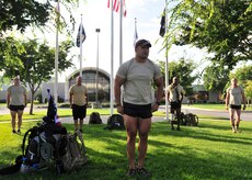 Members of the 13th Air Support Squadron “Delta Flight” assigned to Fort Carson, Colo., stand at attention in front of the Charles C. Carson Center for Mortuary Affairs, Dover Air Force Base, Del., Aug. 4, 2013. The mortuary was the starting point for a 140-mile ruck march to Arlington National Cemetery Aug. 4-8 in honor of Maj. David Gray, who was killed Aug. 8, 2012, in Afghanistan. The memorial ruck march symbolized the route from the mortuary to Gray's final resting place. (U.S. Air Force photo/Tech. Sgt. Chuck Walker)