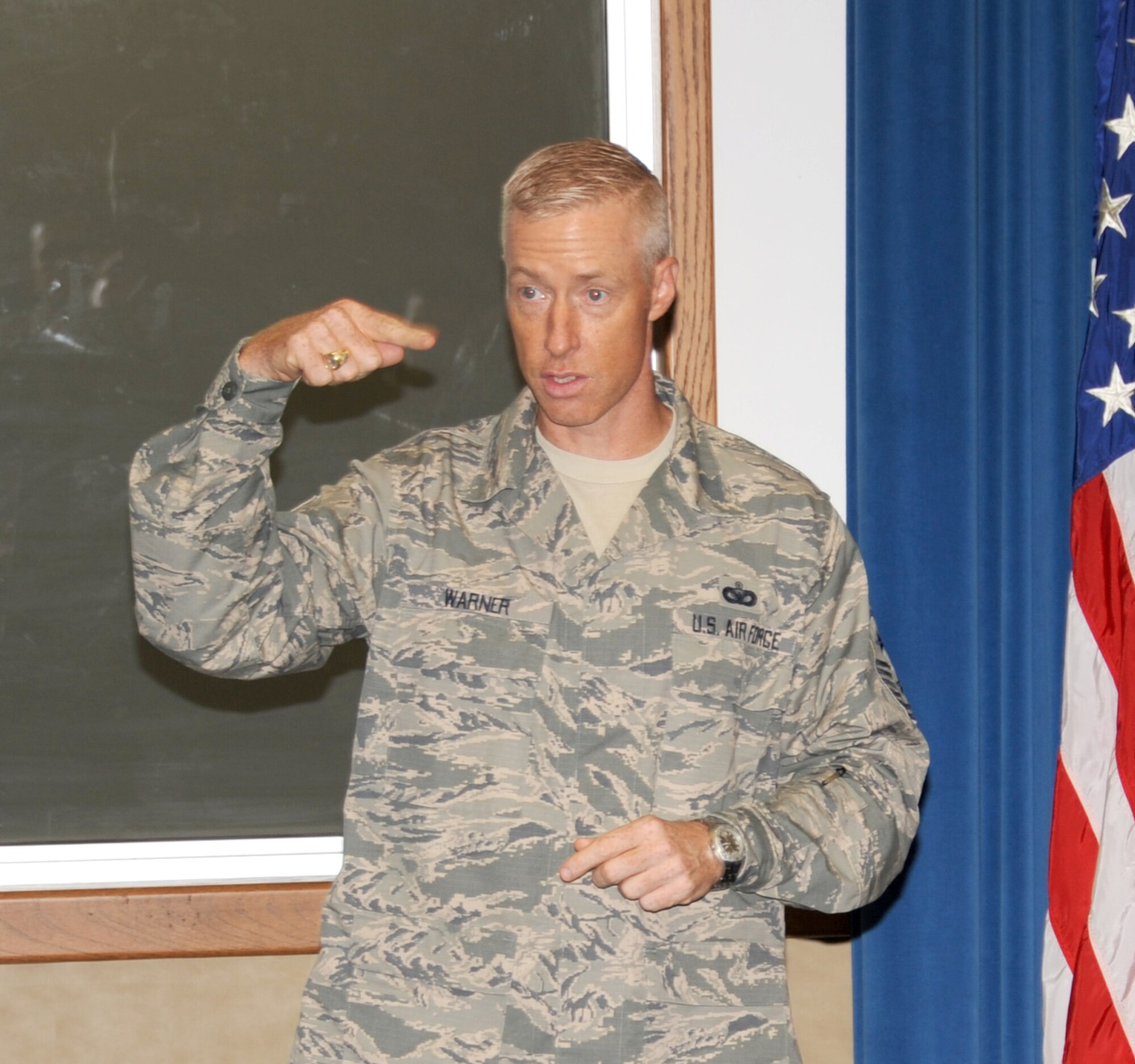 Chief Master Sgt. Michael J. Warner, command chief master 
sergeant of Air Force Materiel Command, spoke about AFMC's mission and priorities Aug. 2. (Photo by Dennis Carlson)