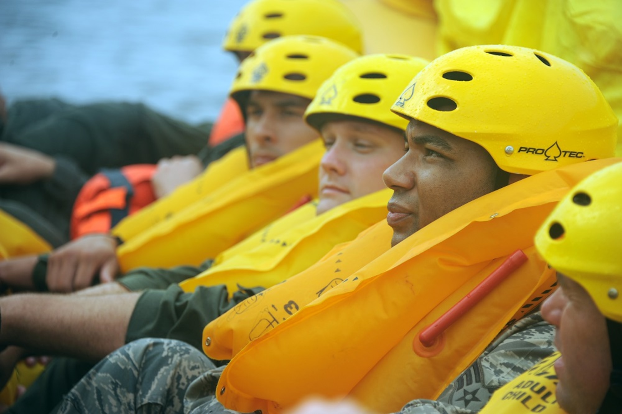 Aircrew members listen to instruction on a raft equipped to the KC-10 Extender during a Survival, Evasion, Resistance and Escape water survival class Aug. 8, 2013, at Long Beach Island, N.J. The class served as a refresher to the original SERE training they received at Fairchild Air Force Base, Wash. (U.S. Air Force photo by Airman 1st Class Sean M. Crowe/Released)